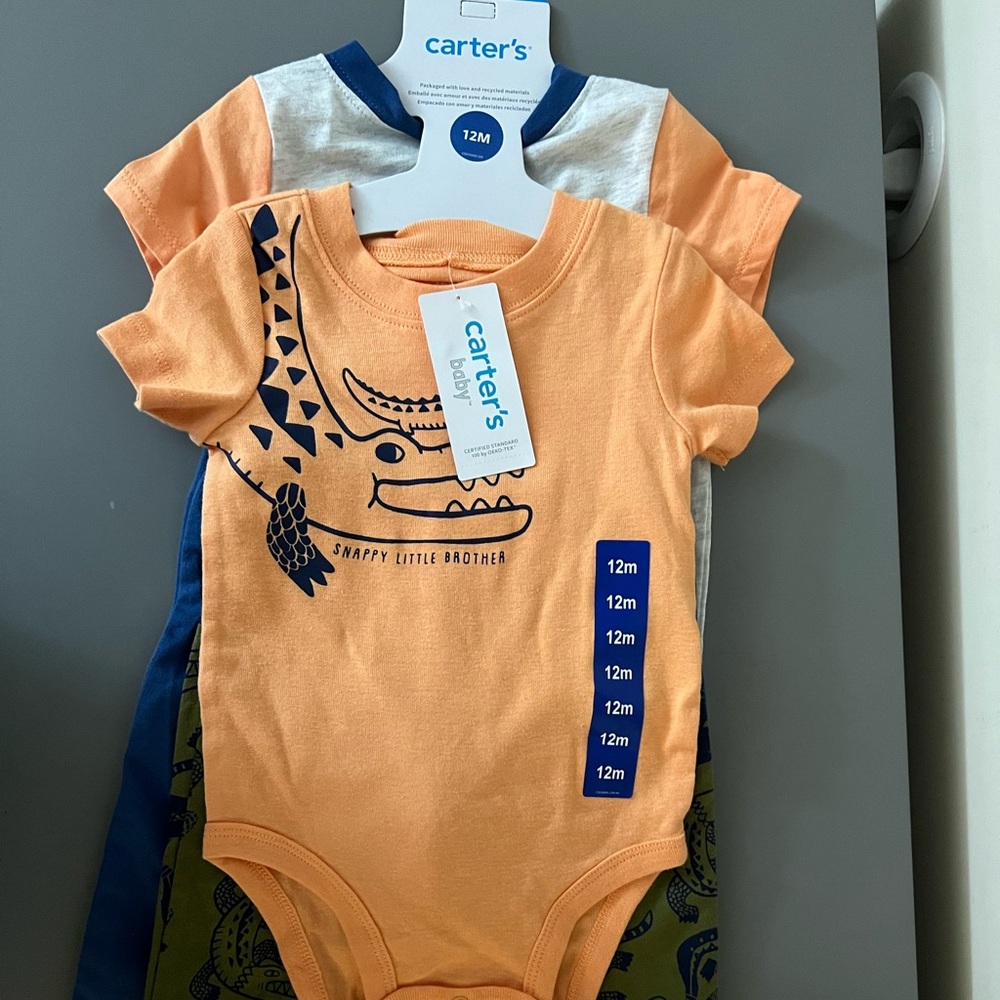 4-piece set for boys from Carter’s Baby. Two onesies and Two pants, Size 12m
